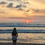 Sophie at the beach watching a sunset