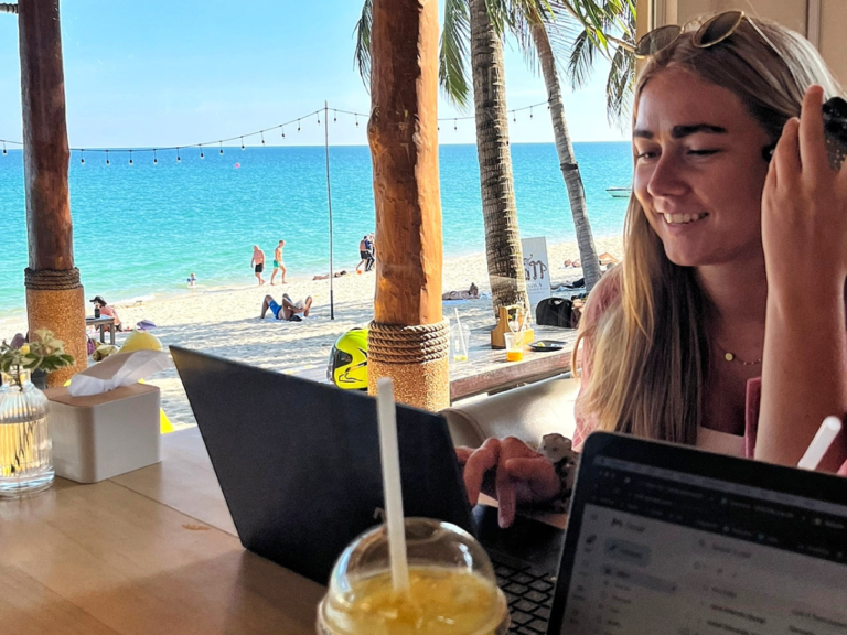 Sophie Working on her laptop in the beach